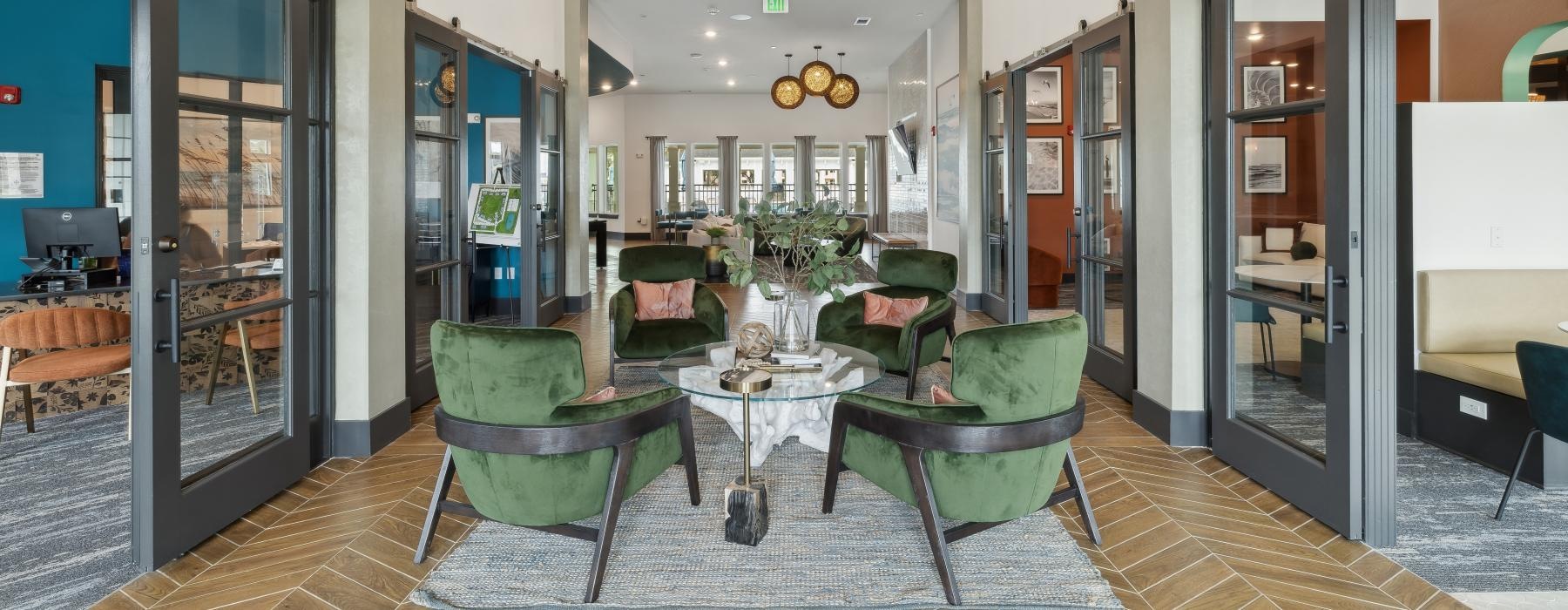 a room with a table chairs and a chandelier