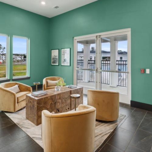 Everything within reach a room with a table chairs and a fan