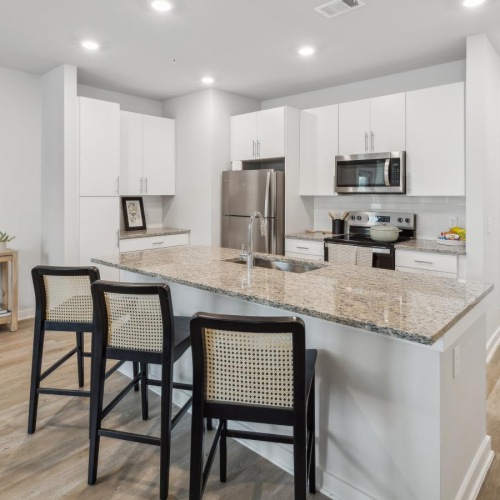 Find your perfect fit at Ascend at Pathstone a kitchen with a marble island