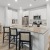a kitchen with a marble island