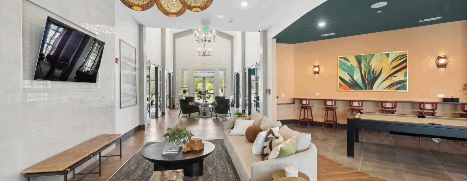 a spacious room with a large light and a couch