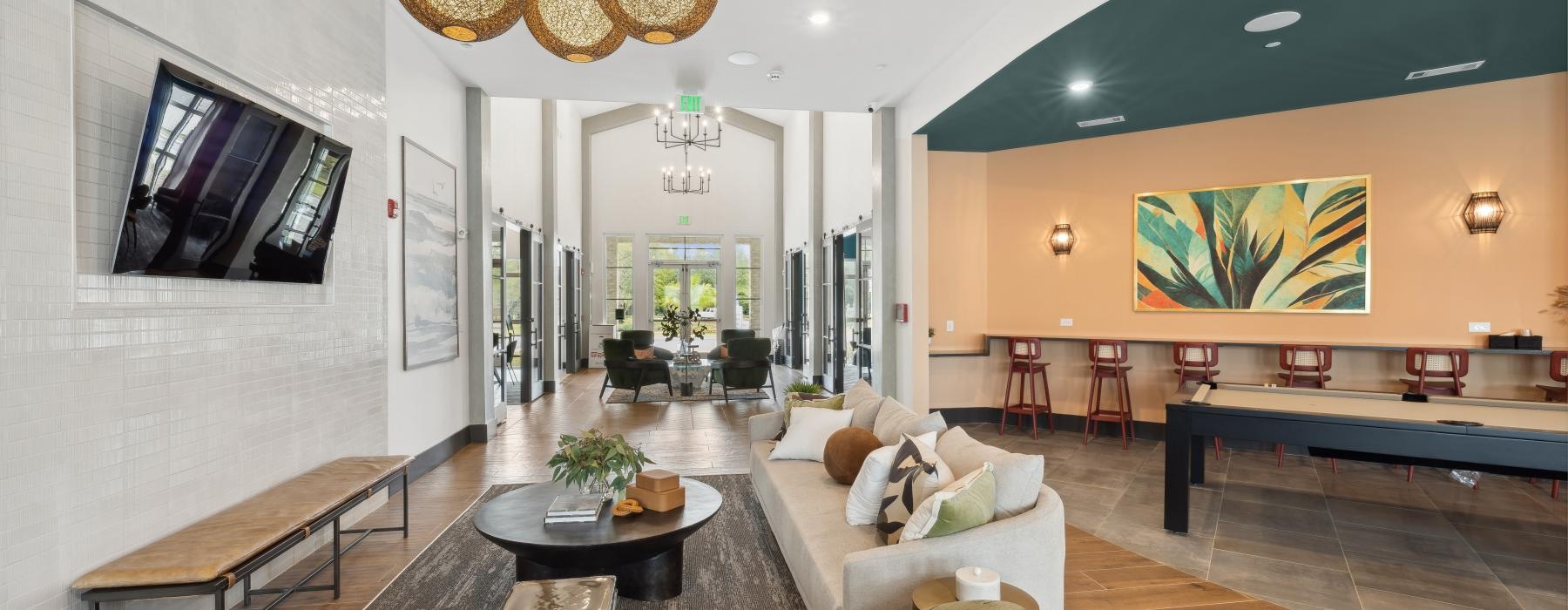 a spacious room with a large light and a couch